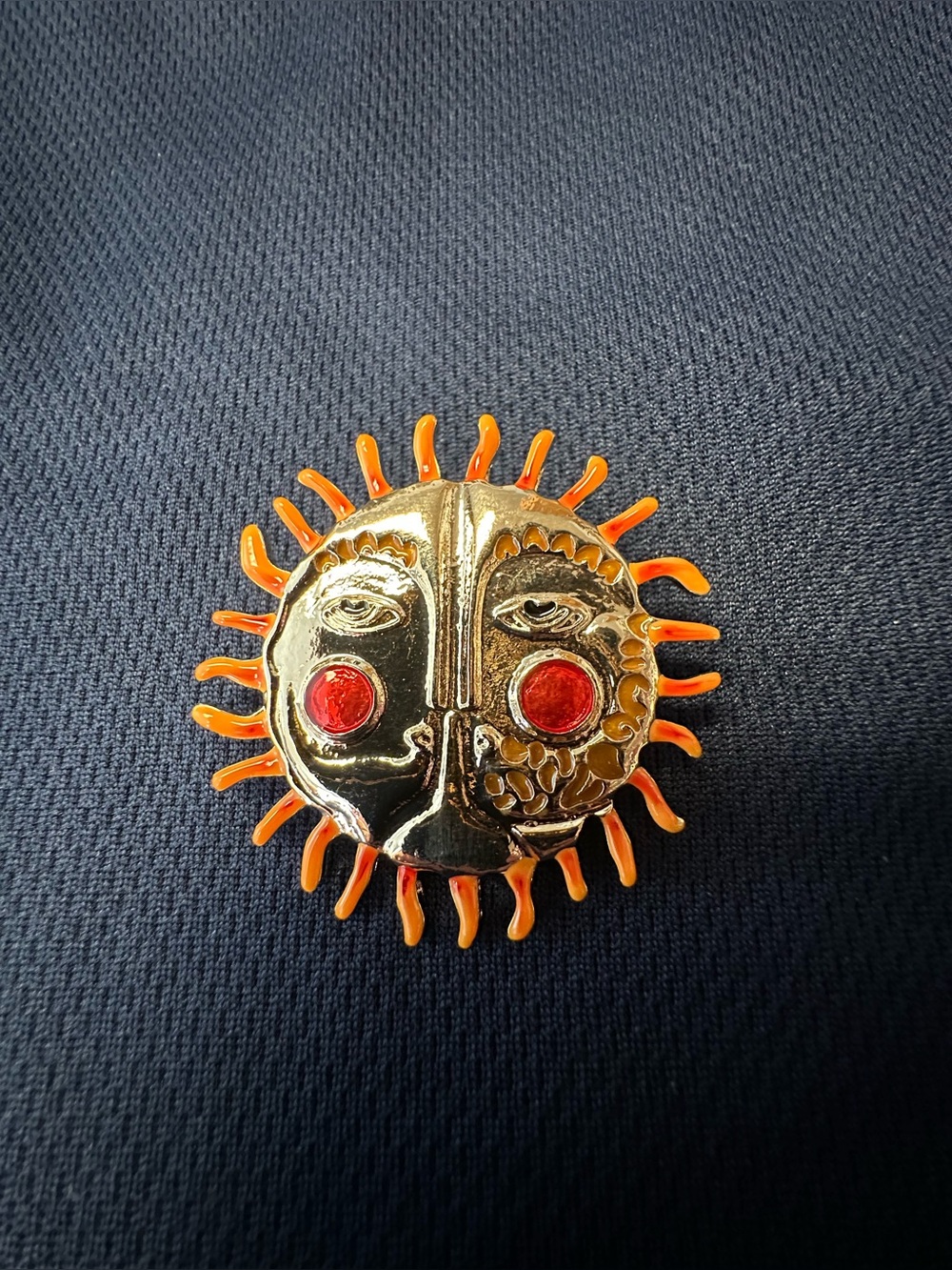 Gold Sun Face Brooch with Orange Rays and Red Accent Eyes